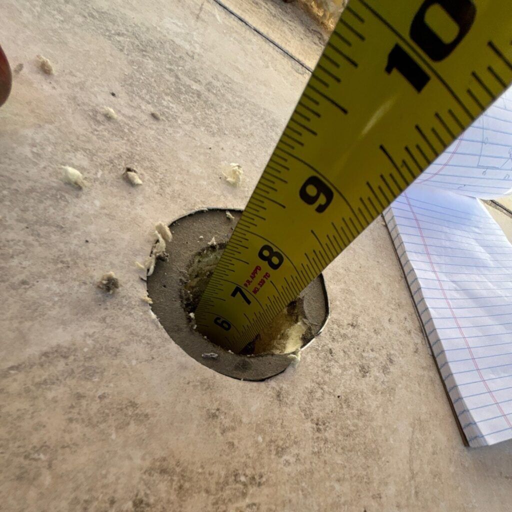 Example of a core sample on a low slope commercial roof that shows the depth to deck.