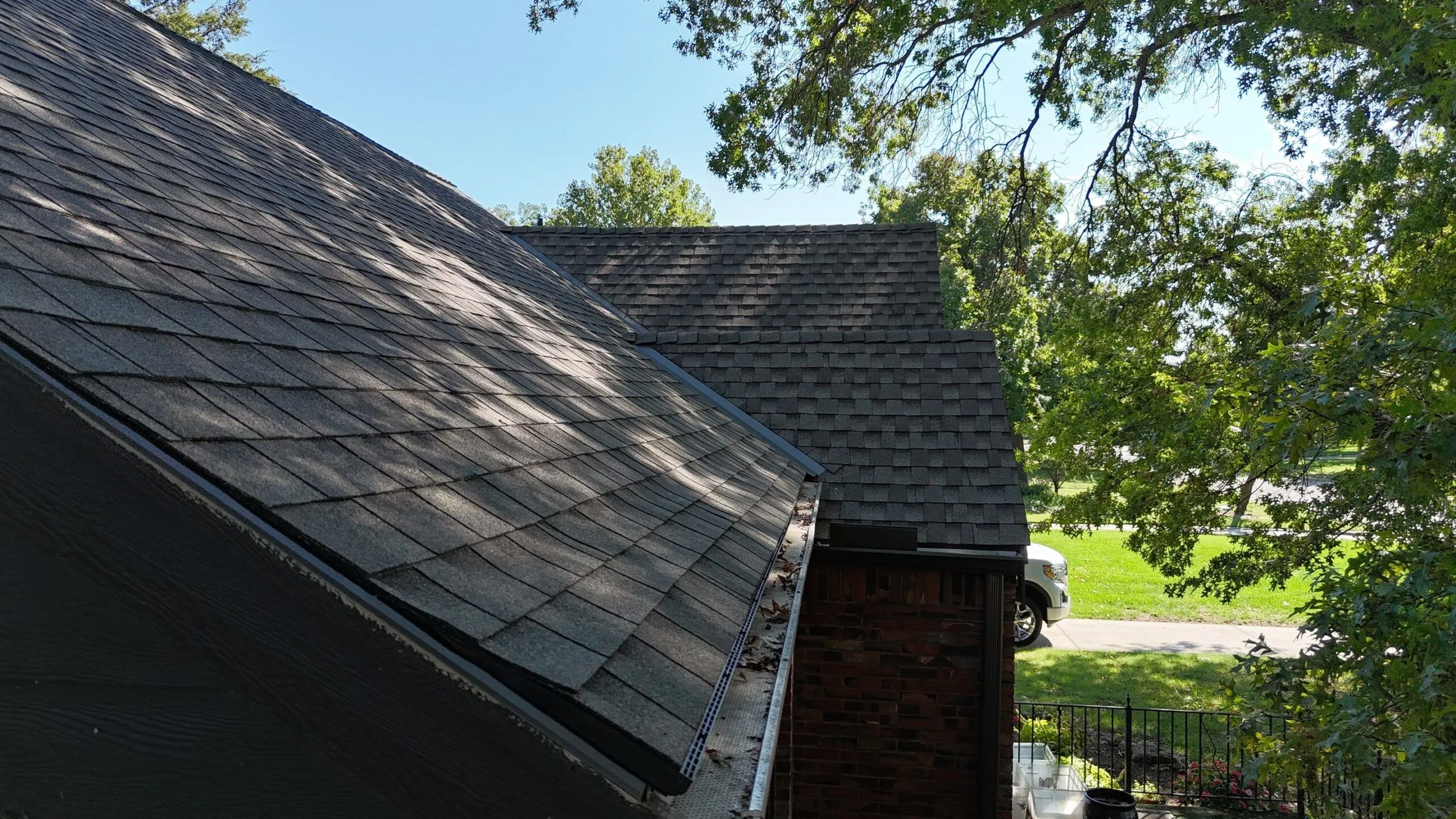 Lomanco's Deck-Air installed as an edge-vent for intake ventilation on an asphalt shingle roof with minimal overhang.