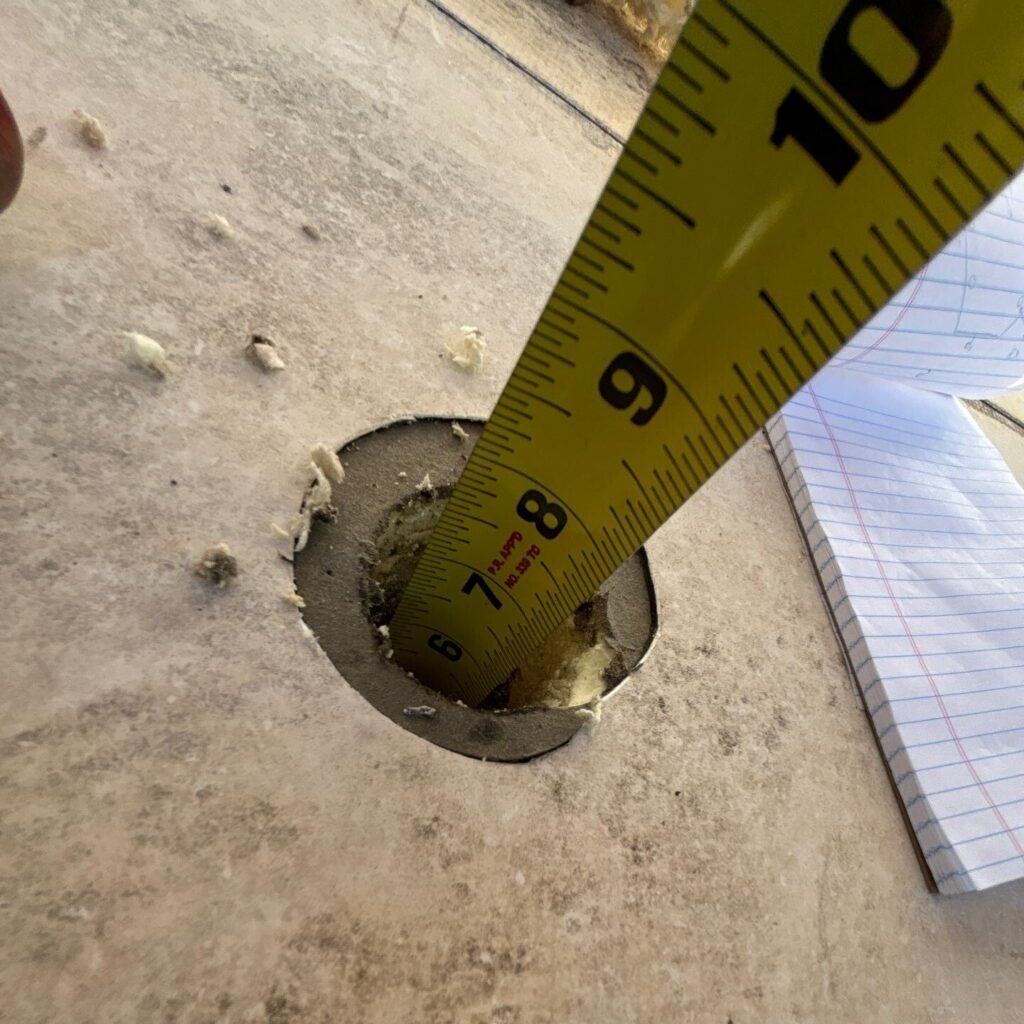 Example of a core sample on a low slope commercial roof that shows the depth to deck.
