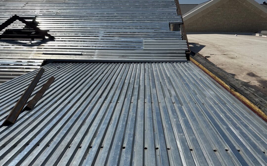 Commercial Roof Decking Guide: Comparing Wood, Metal, & Concrete for Low-Slope Roofs