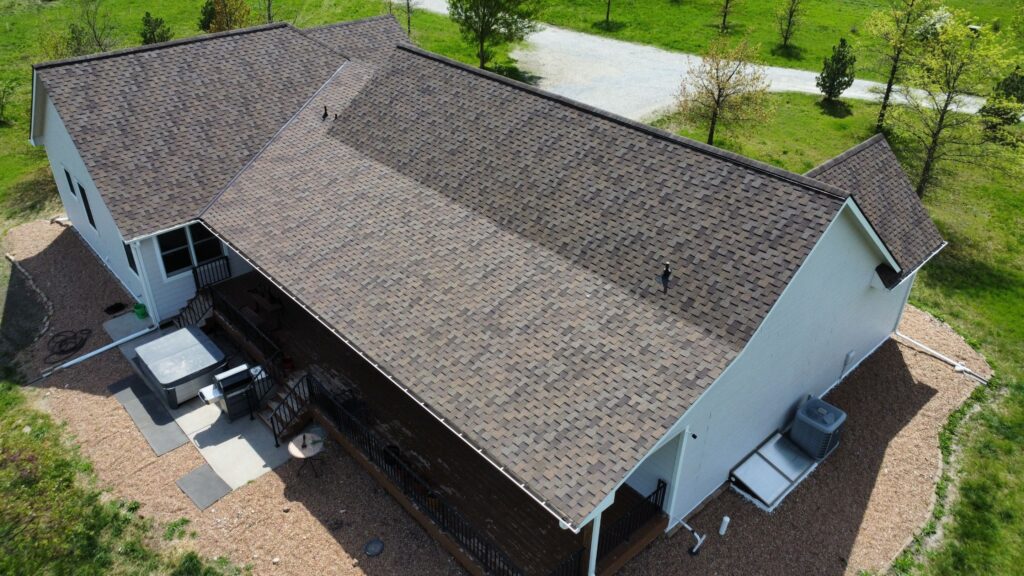 An asphalt shingle Grand Sequoia roof completed by Rhoden Roofing that required access through a long driveway and navigation around sensitive septic tank lines.