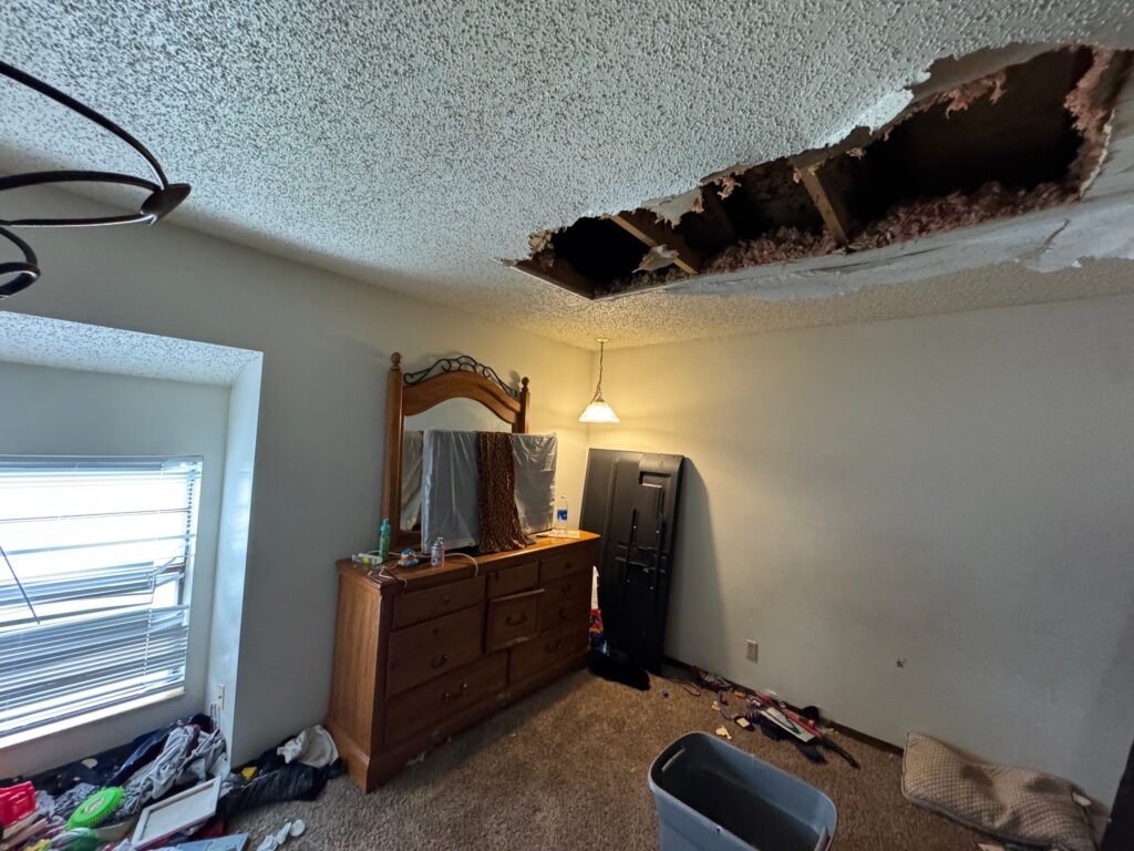 Catastrophic roof failure at a multifamily property, resulting in collapsed sheetrock in a tenant's bedroom.