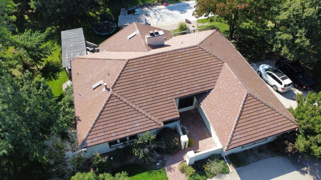 A clay tile roof that required a lift and relay after 20 years of protection.