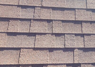 Blistering on architectural asphalt shingles caused by radiant heat from the attic space due to poor attic ventilation.