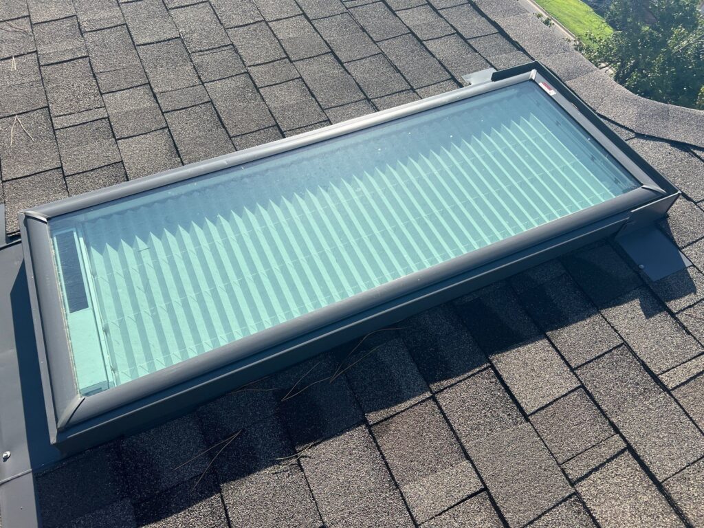 Vented Velux skylights come with built-in shades and a remote control that opens and closes the window.