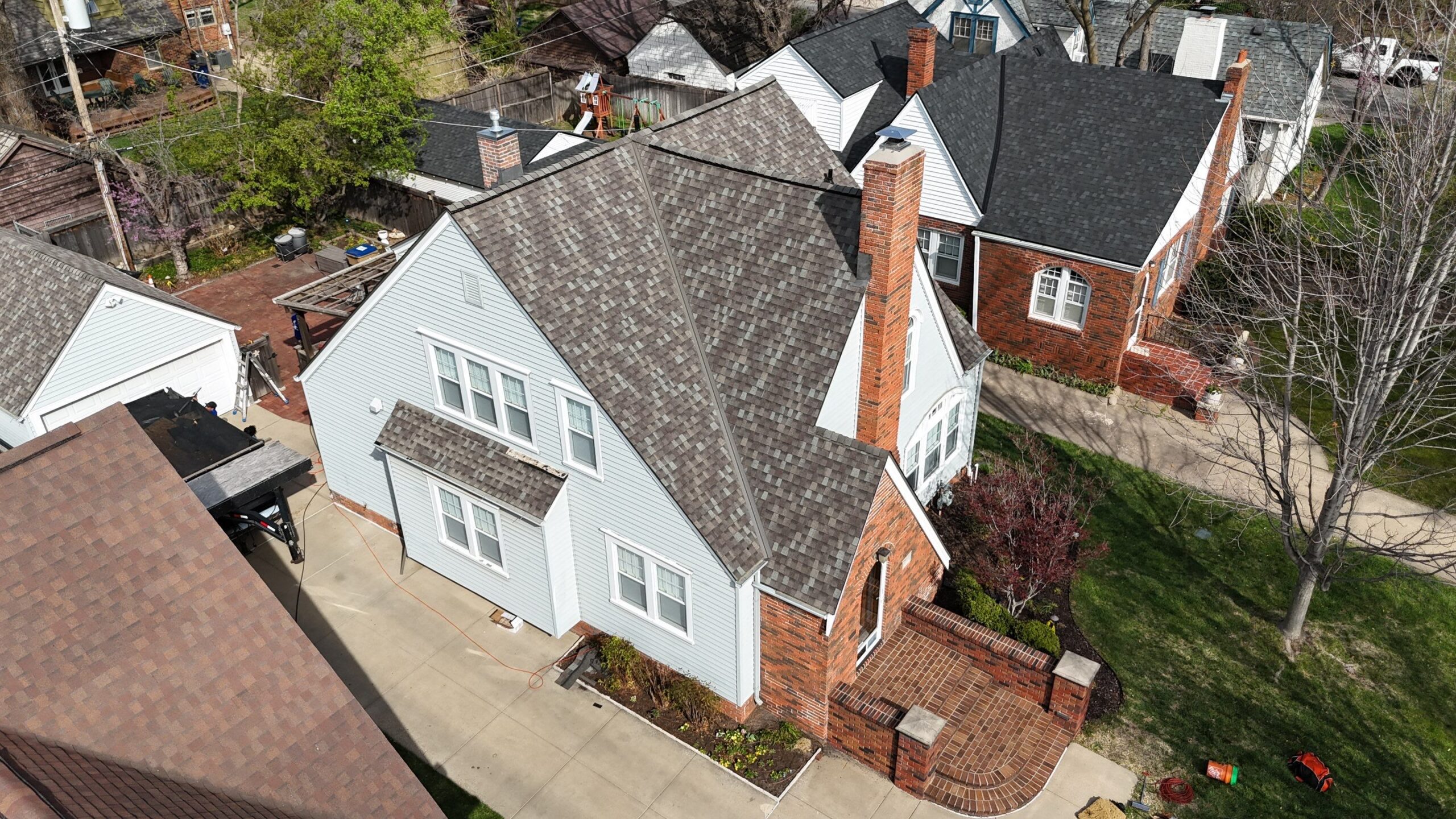 Steep architectural shingle roof with multiple slope tiers and Deck-Air intake ventilation